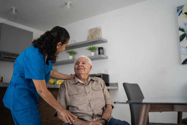 istock Nurse taking care of senior man at home 1398802468