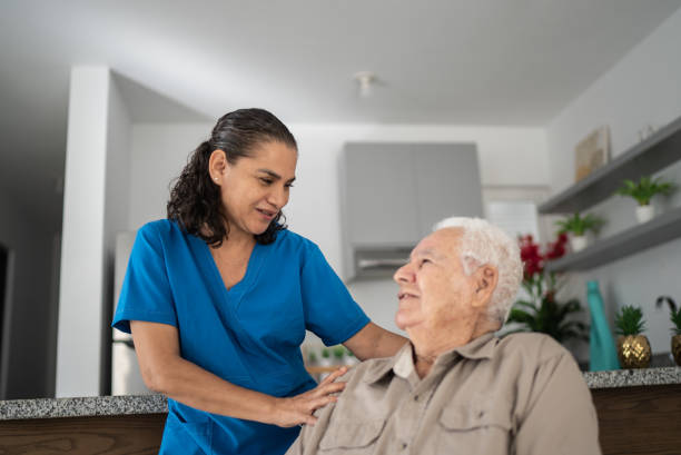 istock Nurse taking care of senior man at home 1398802471