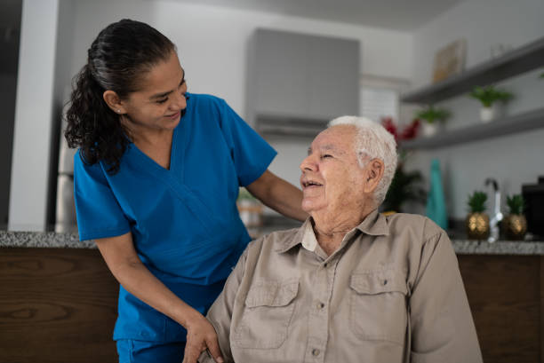 istock Nurse taking care of senior man at home 1398802472