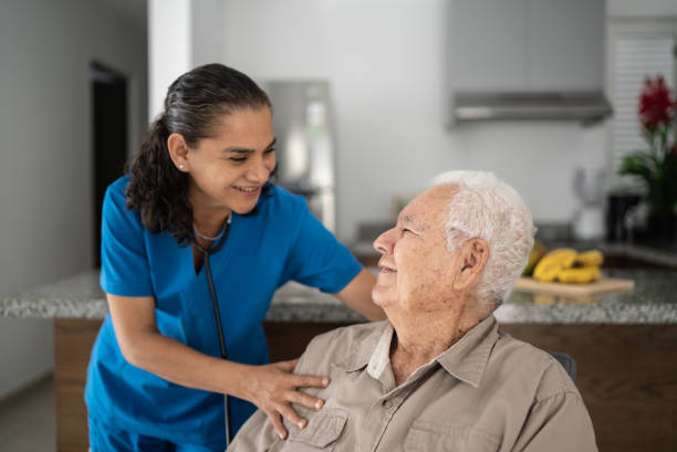 istock Nurse taking care of senior man at home 1398802474