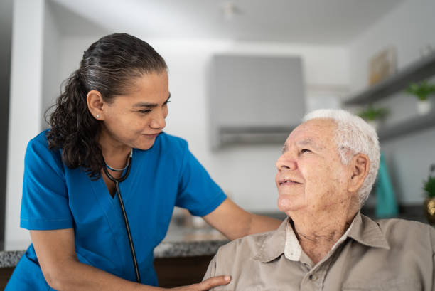 istock Nurse taking care of senior man at home 1398802481