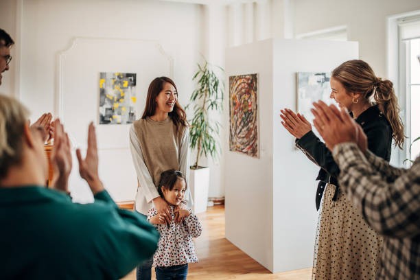 istock Female artist at gallery opening 1398802554