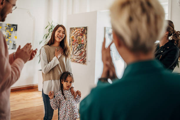 istock Female artist at gallery opening 1398802702