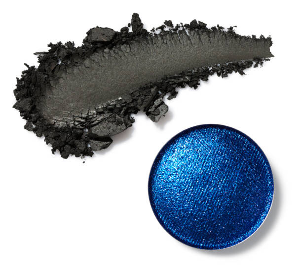 Blue eye shadow and black smear of eyeshadow isolated on white stock photo