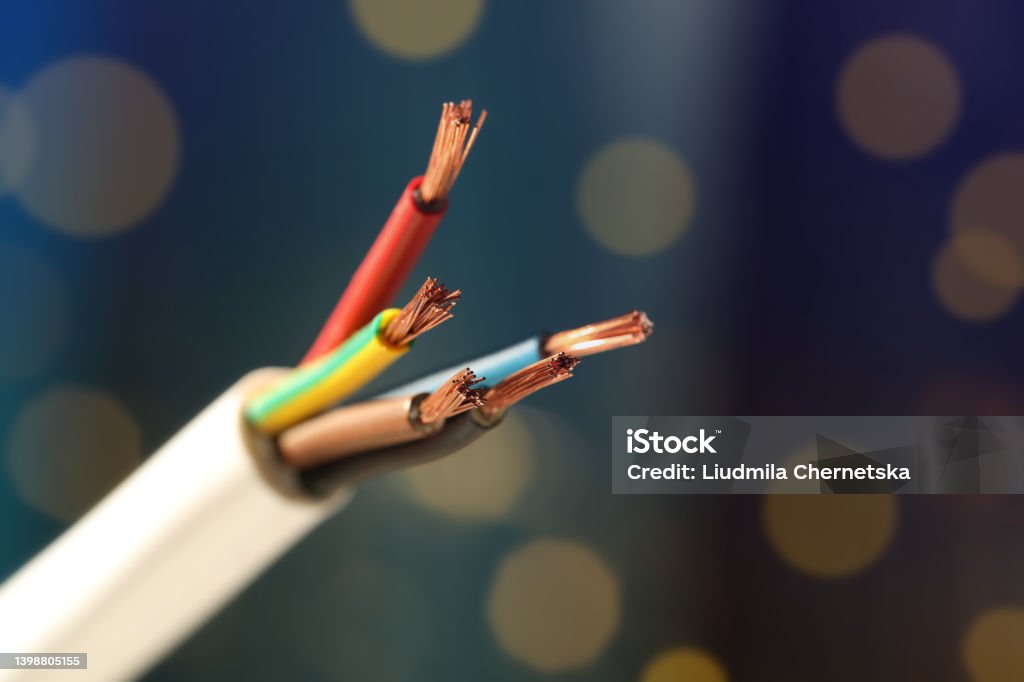 Cable with copper wires against blurred background, closeup Cable Stock Photo