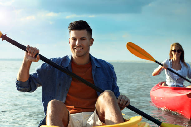 istock Happy couple kayaking on river. Summer activity 1398805413