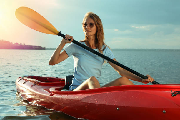 istock Beautiful woman kayaking on river. Summer activity 1398805414