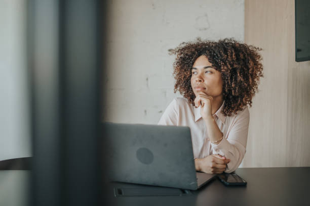 istock Businesswoman working at her desk 1398805428