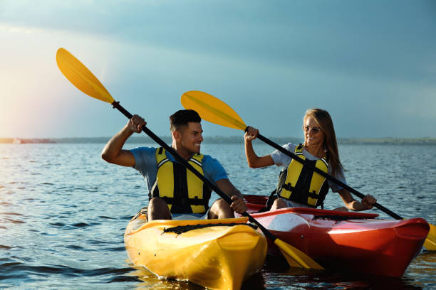 istock Couple in life jackets kayaking on river. Summer activity 1398805465