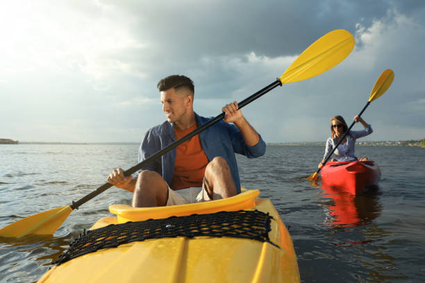 istock Beautiful couple kayaking on river. Summer activity 1398805505