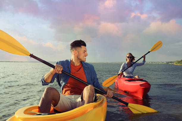 istock Beautiful couple kayaking on river. Summer activity 1398805510