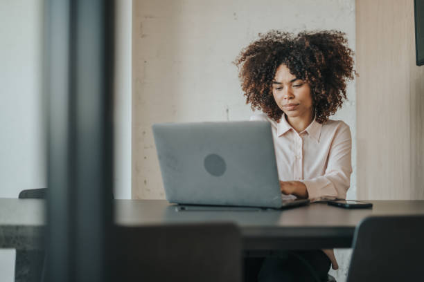 istock Businesswoman working at her desk 1398805814