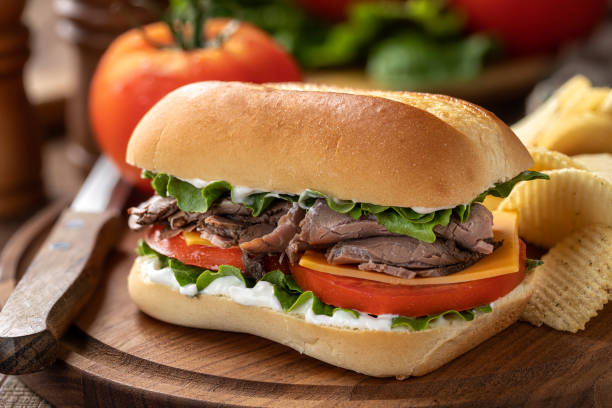 istock Roast beef sandwich with cheese, tomato and lettuce 1398806497