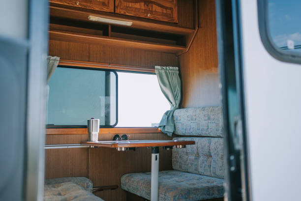 istock looking through door inside of motorhome with table and sofa backseat beside window 1398807343