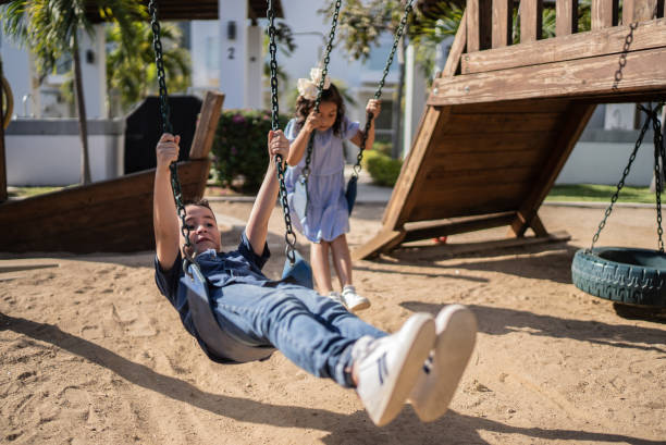 istock Children swinging in the park 1398808807
