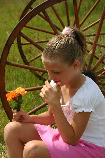 Girl Holding Flowers stock photo