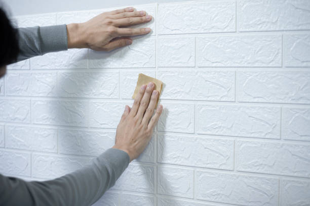 istock Worker hands sticking wallpaper on wall, Home decoration by yourself, Copy space. 1398814201