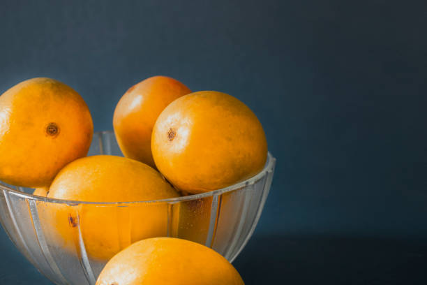 istock mangoes in basket blue dark background 1398814328