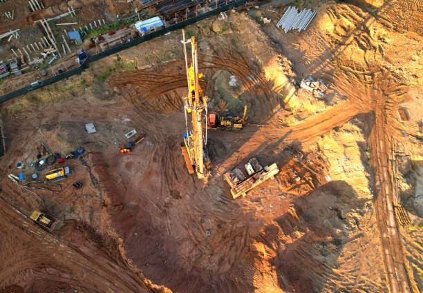 istock Deep foundation machine. Drilling rig and Pile driver at construction site. Pile driven into ground by vibrating hydraulic hammer. 1398814367