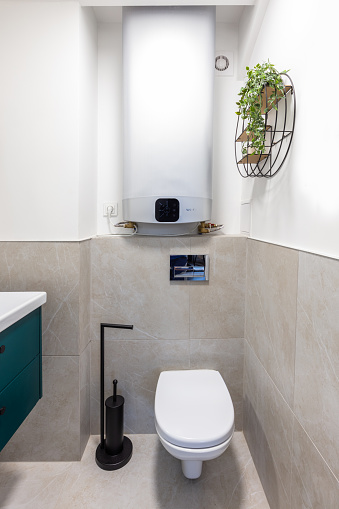 Small bathroom with new gas heating oven. Clean and modern