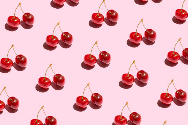 istock Seamless pattern with cherry. Tropical abstract background. Cherry on pastel pink background. 1398815507