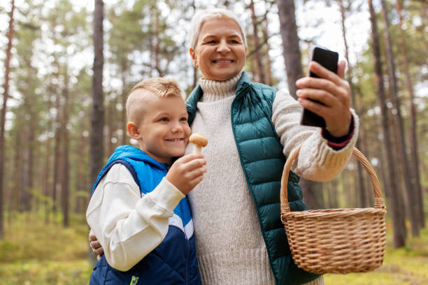 grandmother and grandson with baskets take selfie