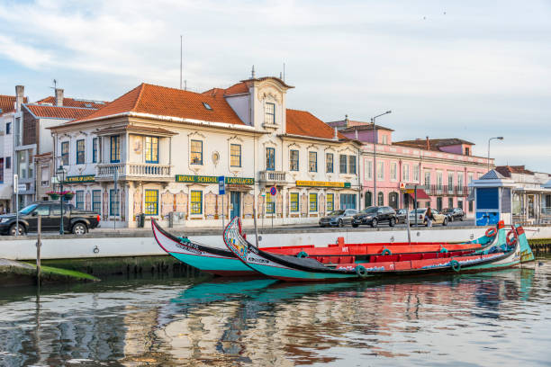 Aveiro District, Portugal - May 20, 2017: Urban scene with boats anchored on the bank of the canal in the city of Aveiro