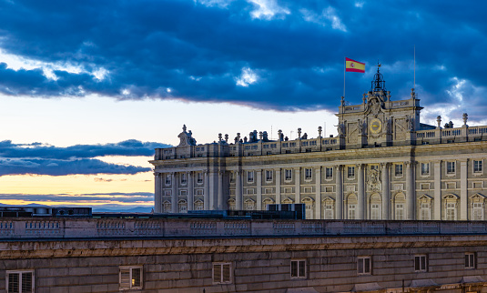 Madrid, Spain - April 24, 2022: A picture of the Royal Palace of Madrid at sunset.