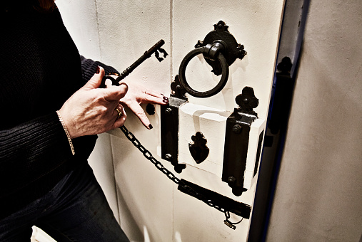 An old door with a big iron key