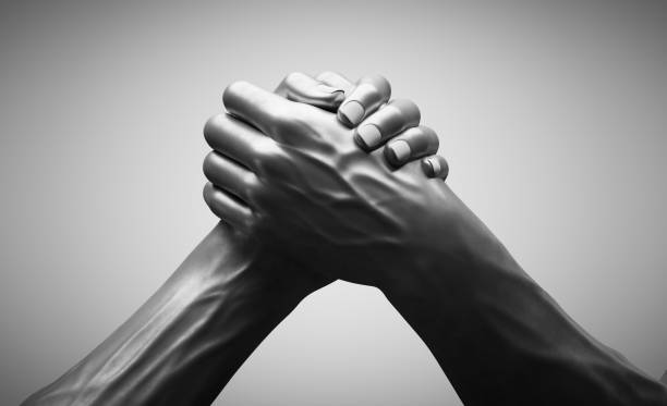 istock Handshake of steel hands 1398819542
