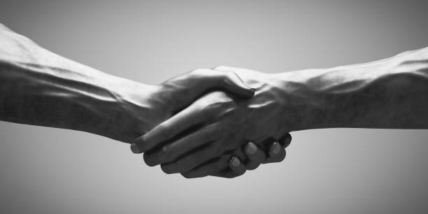istock Handshake of steel hands 1398819556
