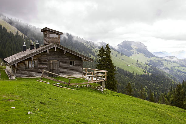 Alpine hut on a cloudy day stock photo