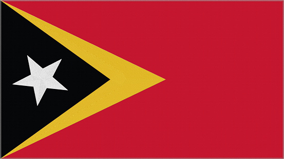 East Timor embroidery flag. Emblem stitched fabric. Embroidered coat of arms. Country symbol textile background.