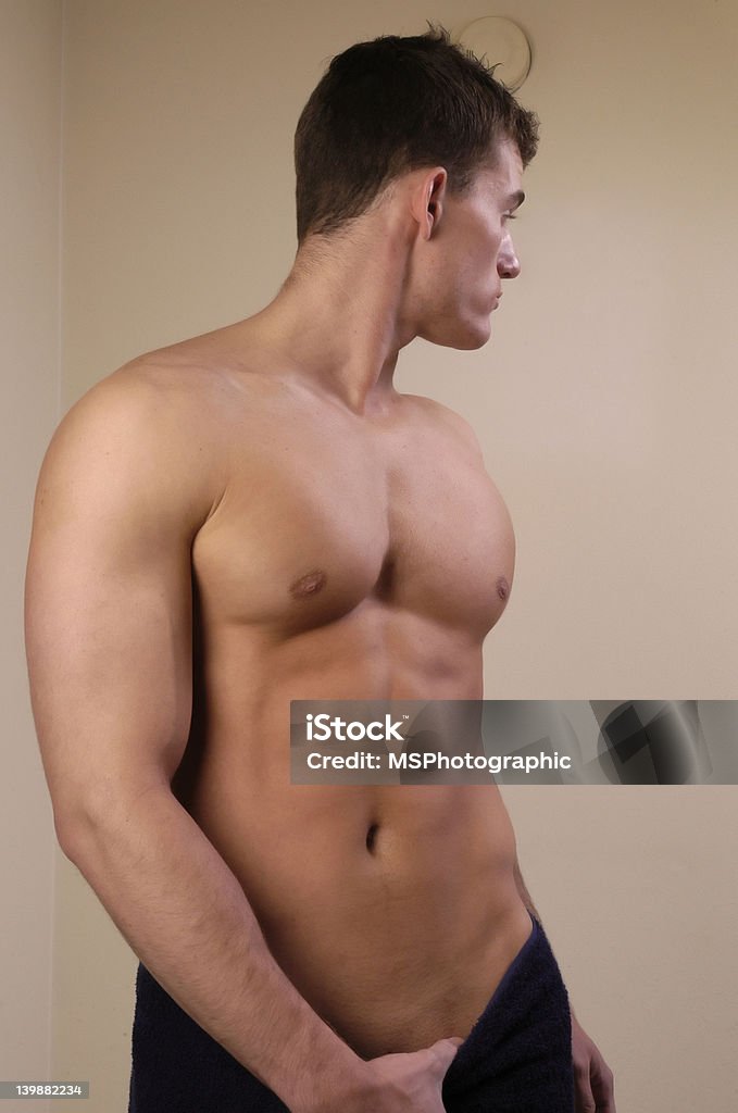 Handsome Man A shirtless man in a towel Abdomen Stock Photo