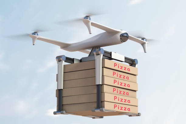 consegna aerea della pizza utilizzando un veicolo aereo senza equipaggio - helicopter air vehicle business cargo container foto e immagini stock