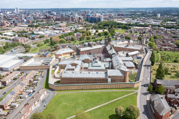 Aerial drone photo of the town of Armley in Leeds West Yorkshire in the UK, showing the famous HM Prison Leeds, or Armley Prison, showing the Jail walls from above on a sunny summers day. Aerial drone photo of the town of Armley in Leeds West Yorkshire in the UK, showing the famous HM Prison Leeds, or Armley Prison, showing the Jail walls from above on a sunny summers day. hm government stock pictures, royalty-free photos & images