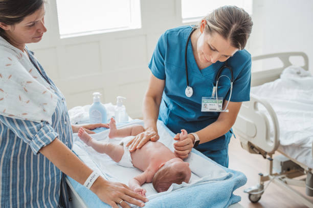 istock New born baby with his mother at hospital ward 1398823708