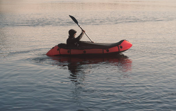 istock Man paddling on a packraft. Boat trip 1398823877