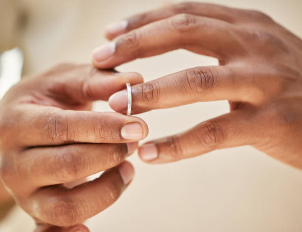 istock Man removing wedding band. Male hands taking off ring before going out to cheat. Finalising divorce 1398824662