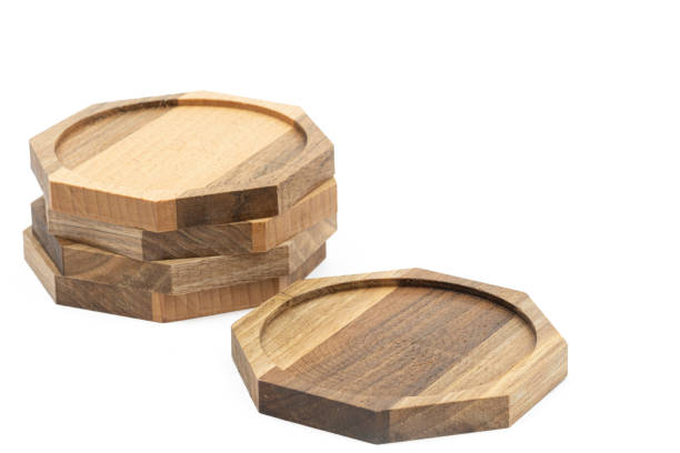 istock Octagon walnut wooden coasters isolated above white background. 1398824744