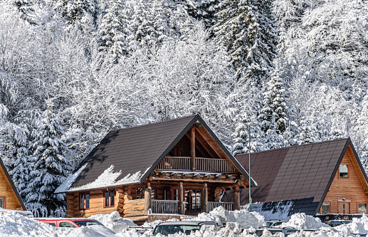 Alpine Hut. Snow covered Winter Scenery.