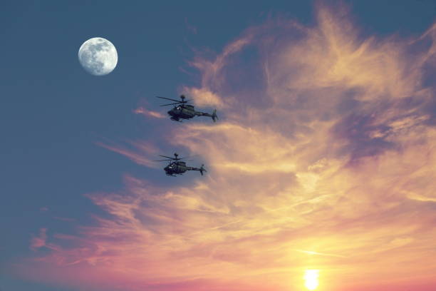 istock Two Kiowa helicopters in flight 1398825363