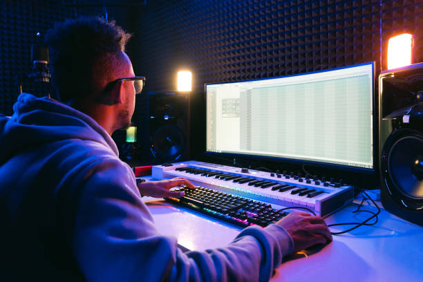 istock Young sound producer working at studio 1398826262