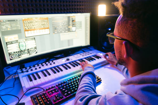 istock Young sound producer working at studio 1398826270