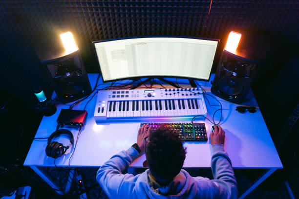 istock Young sound producer working at studio 1398826284