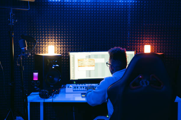 istock Young sound producer working at studio 1398826304