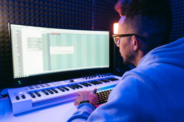 istock Young sound producer working at studio 1398826334
