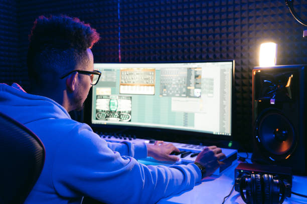istock Young sound producer working at studio 1398826352