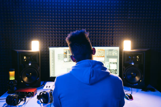 Young sound producer working at studio