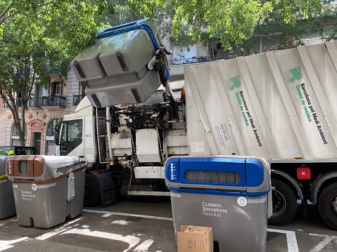 Green colored waste removal truck